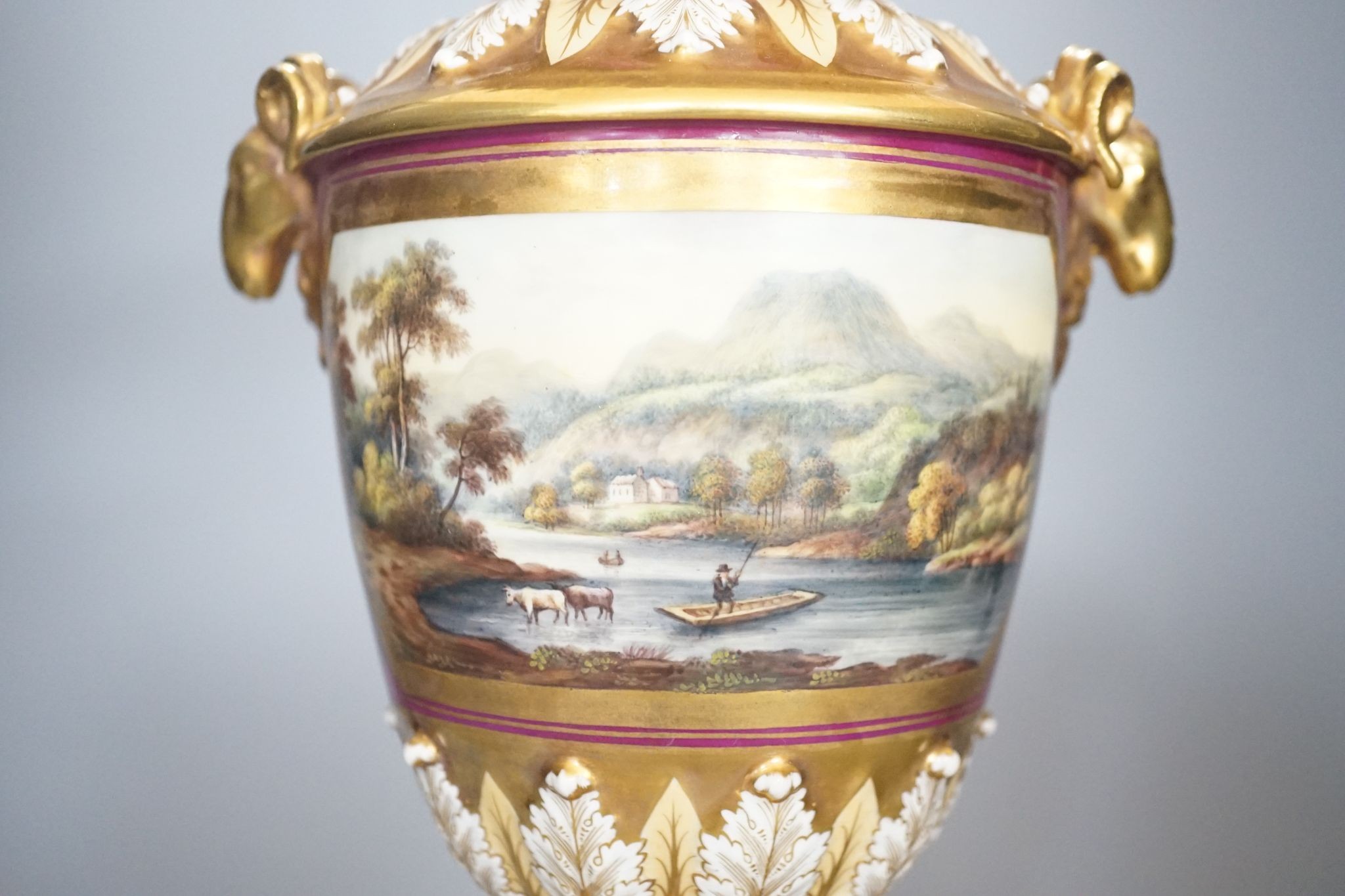 A 19th century English porcelain vase painted with a landscape on crimson ground, Worcester? 35cm